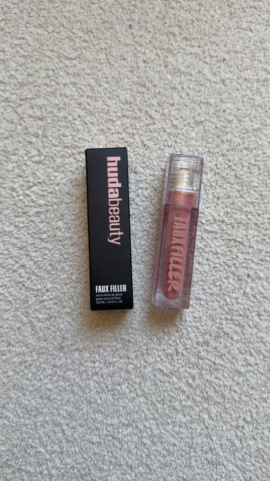 HUDA BEAUTY
Faux Filler Extra Shine Lip Gloss