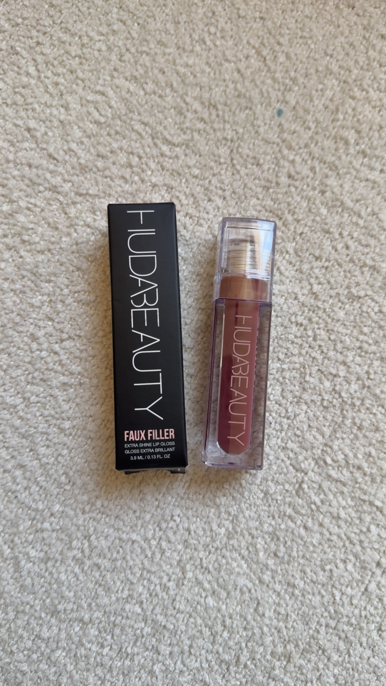 HUDA BEAUTY
Faux Filler Extra Shine Lip Gloss