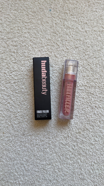 HUDA BEAUTY
Faux Filler Extra Shine Lip Gloss